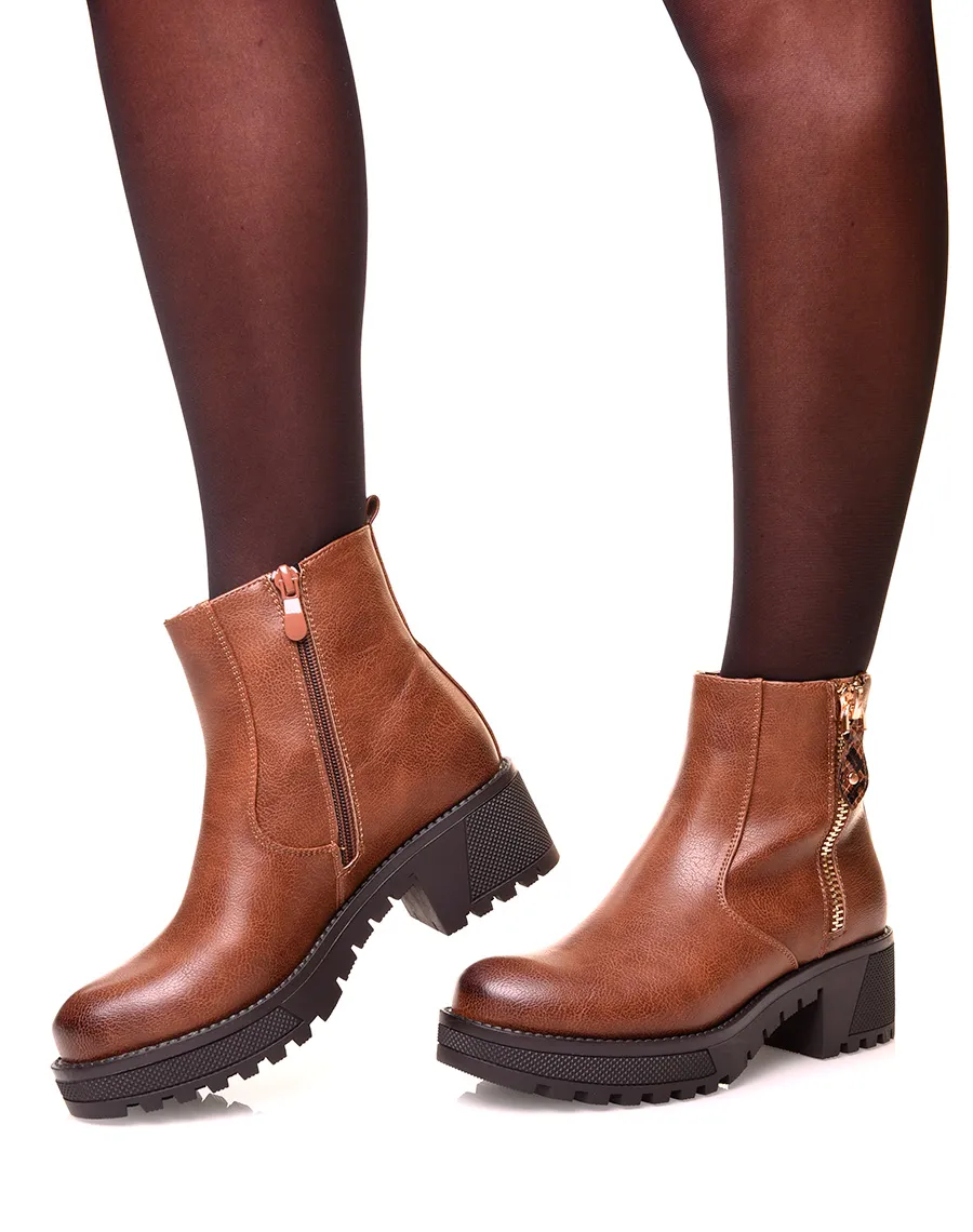 Camel boots with treaded soles